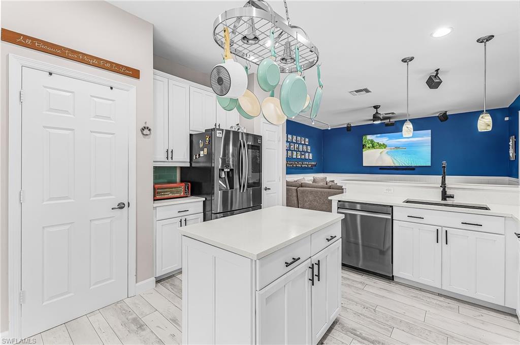 Light, bright and open kitchen. Recently remodeled. Tile backsplash, Quartz countertops, new LVT flooring.