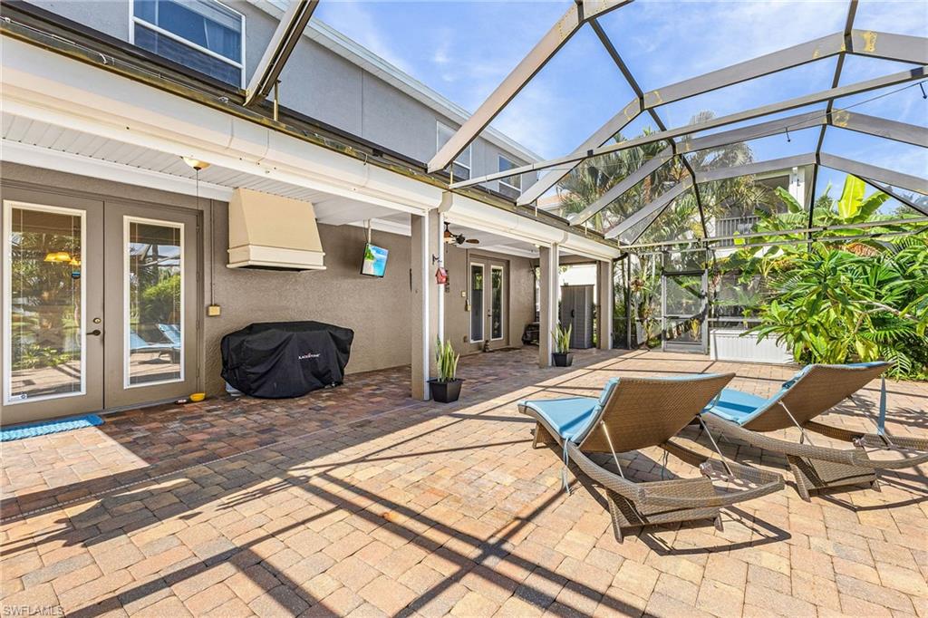 The screened patio offers plenty of undercover entertaining space,