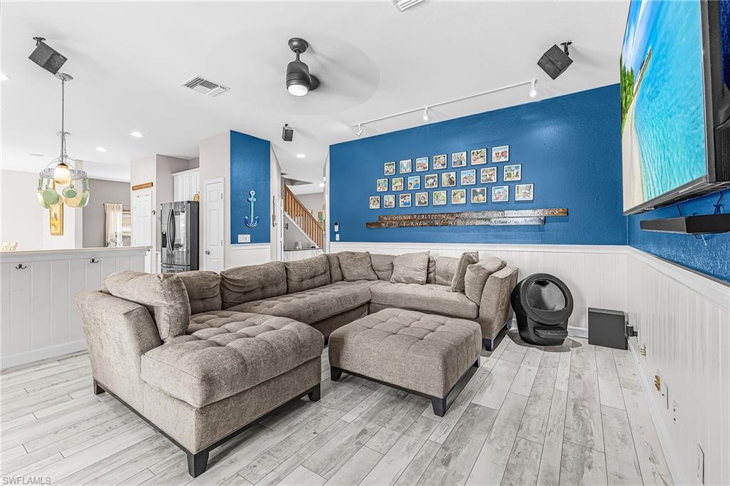 The kitchen opens to the spacious great room with new LTV flooring, new paint, slat board accents.