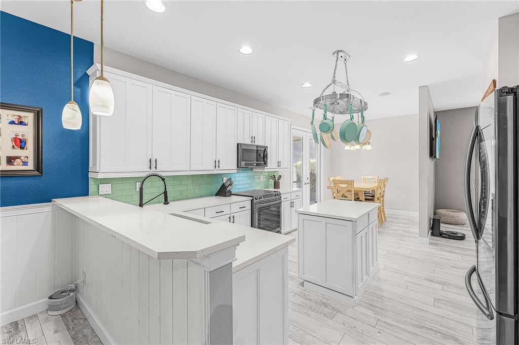 Beautifully remodeled kitchen with plenty of cabinet and counter space.