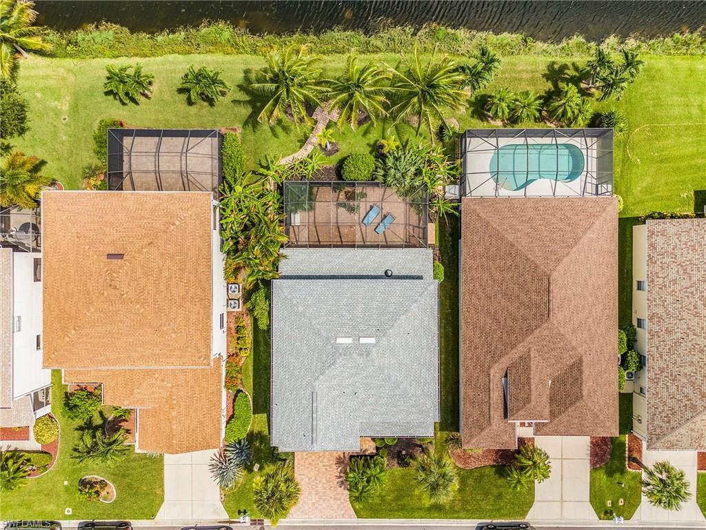 Aerial view of this home with the lake in back.