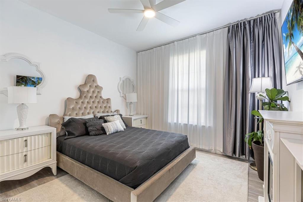Bedroom featuring light wood-style flooring and ceiling fan