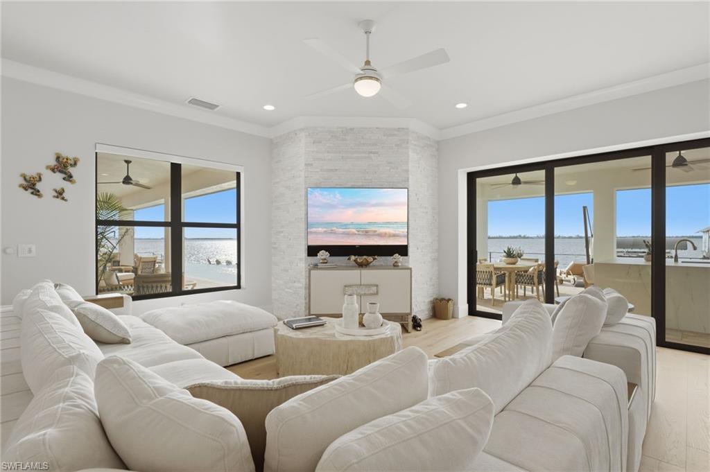 Expansive river views unfold from every vantage point, creating a breathtaking backdrop throughout the home.