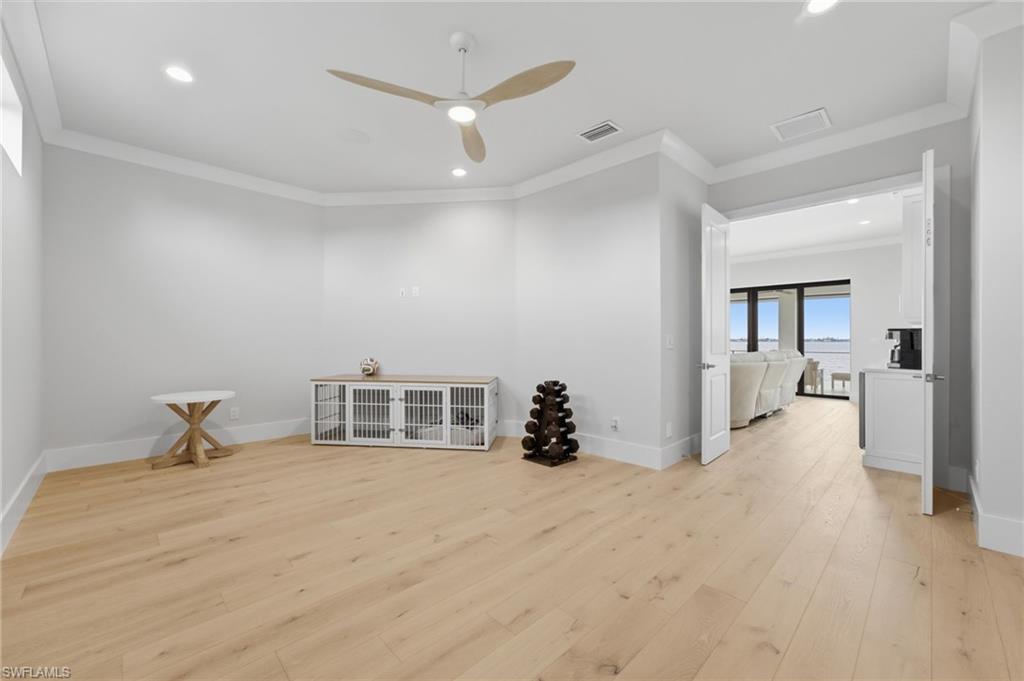 A versatile bonus room on the second level offers endless possibilities, effortlessly adapting to your lifestyle as a private fitness studio, sophisticated home office, intimate theater, creative studio, or inviting playroom—an exceptional space limited only by your imagination.