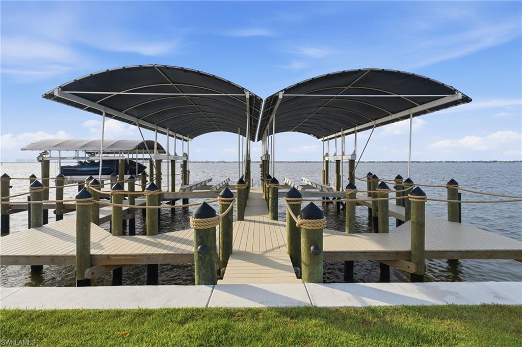 The fully canopied dock accommodates two 30,000-pound boat lifts for vessels up to 50 feet, along with two dedicated jet-ski lifts. Water and electric service are readily available, while a Halo 5 whole-home water purification system delivers pristine, spot-free water for washing and caring for your prized vessels and watercraft.