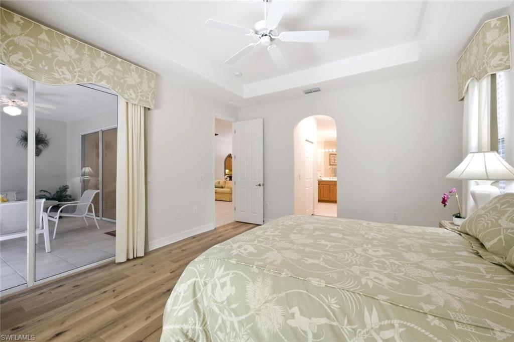 The owner's suite includes sliding glass doors that lead to the Florida lanai.