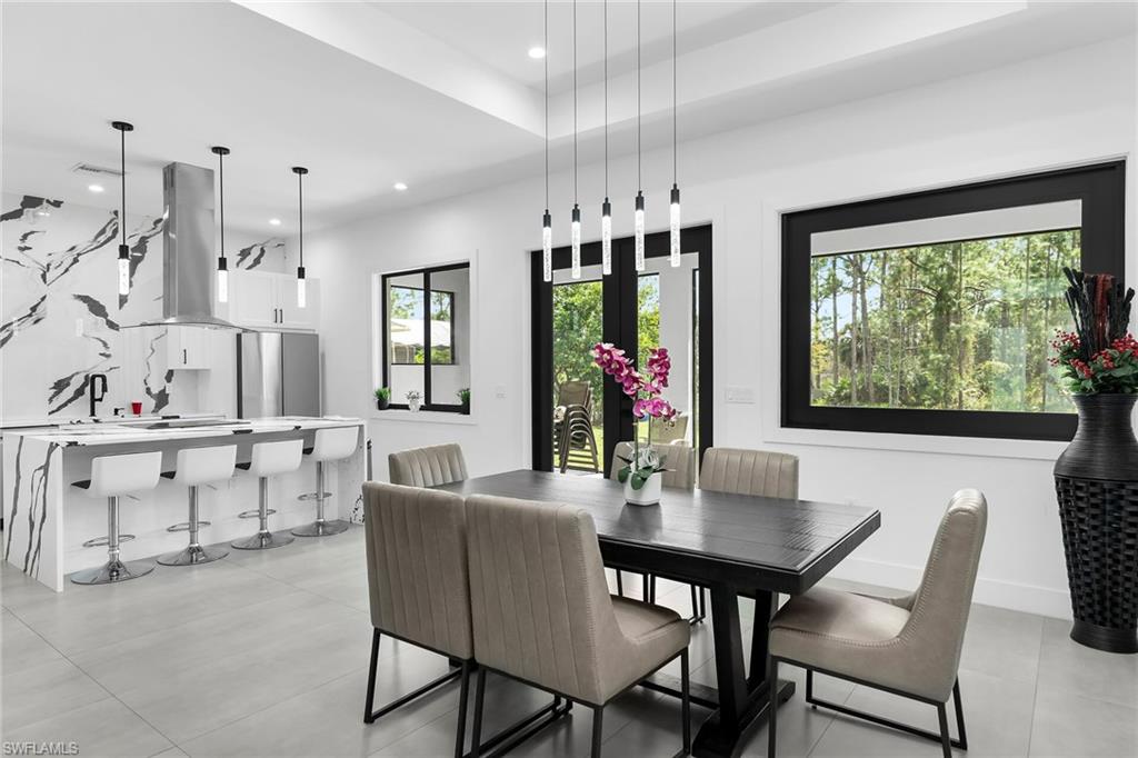 Open-concept living space featuring a modern kitchen and dining area