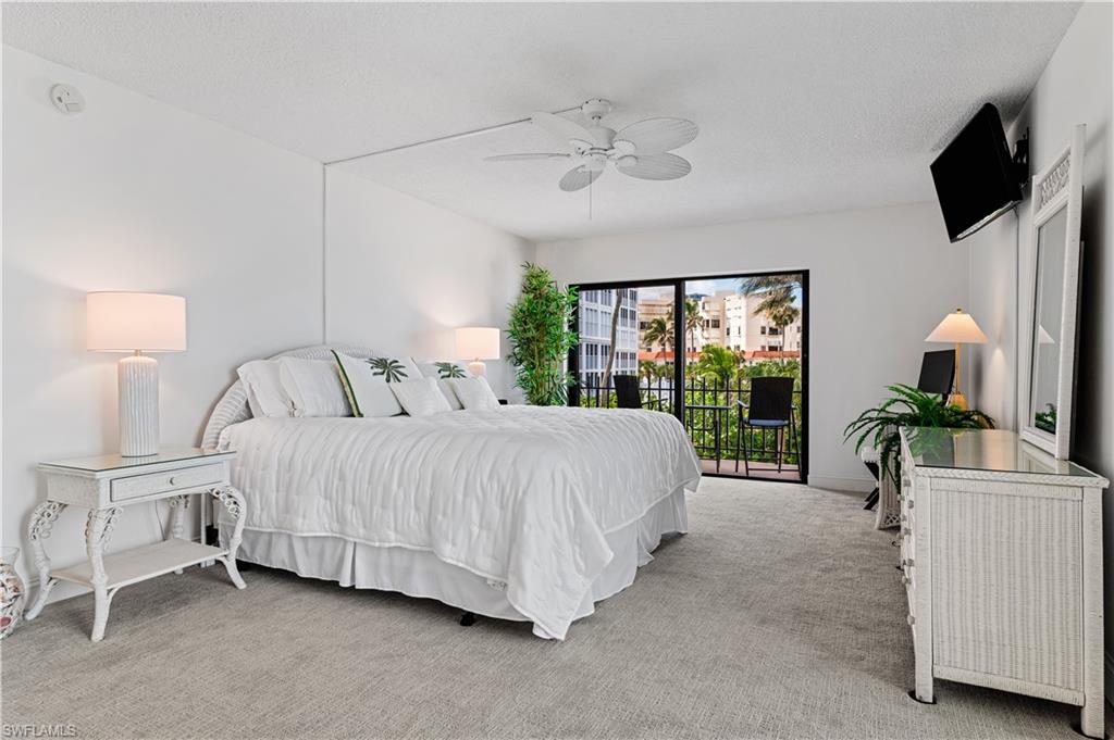 Bedroom with light-toned wall-to-wall carpeting and neutral wall paint