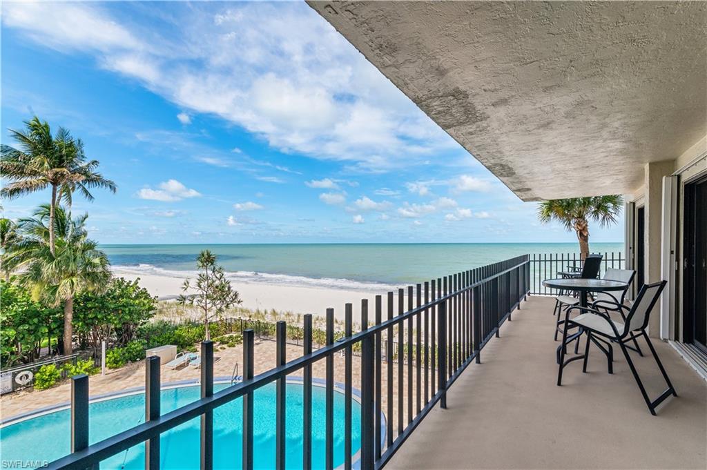 Expansive private balcony with direct beachfront access