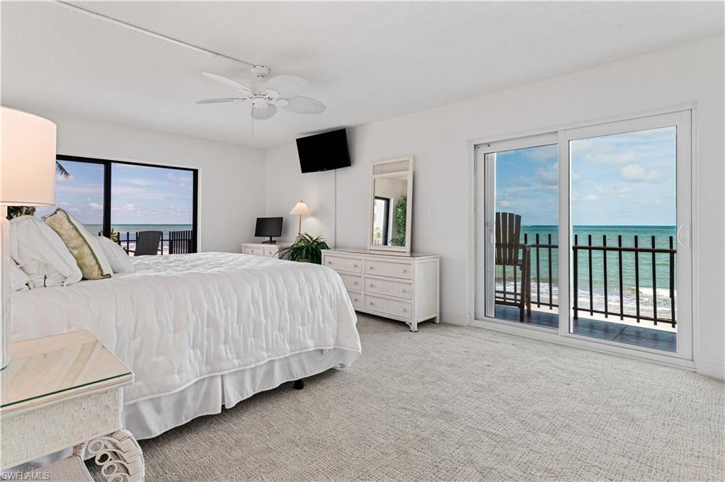 Bedroom featuring light-colored carpeting, white walls, and a ceiling fan