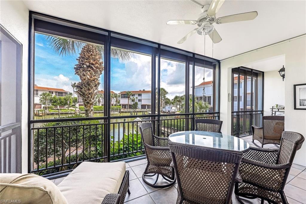 Sunroom / solarium featuring ceiling fan