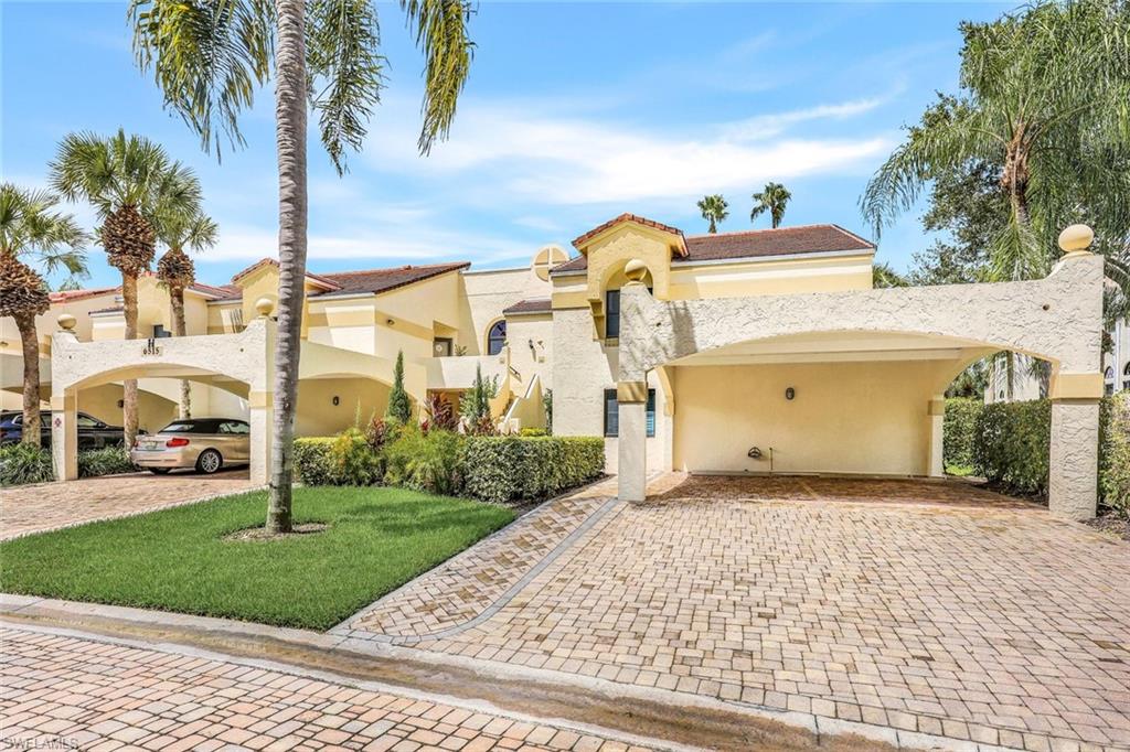 Mediterranean / spanish-style home featuring a carport and a front yard