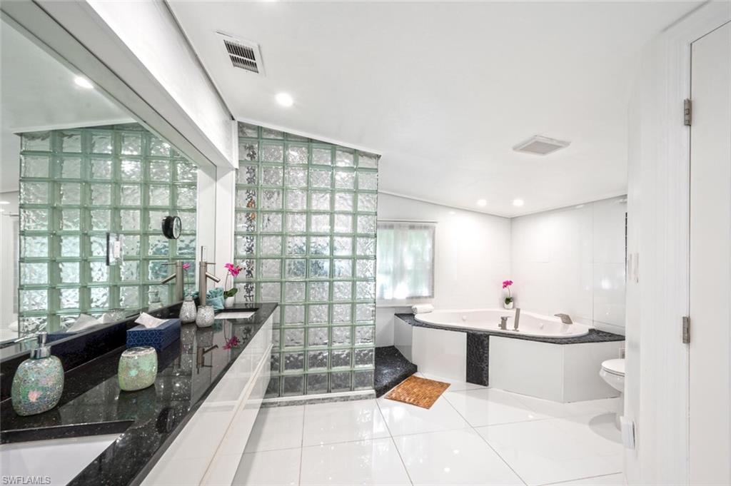 left residence master bath with walk in closet