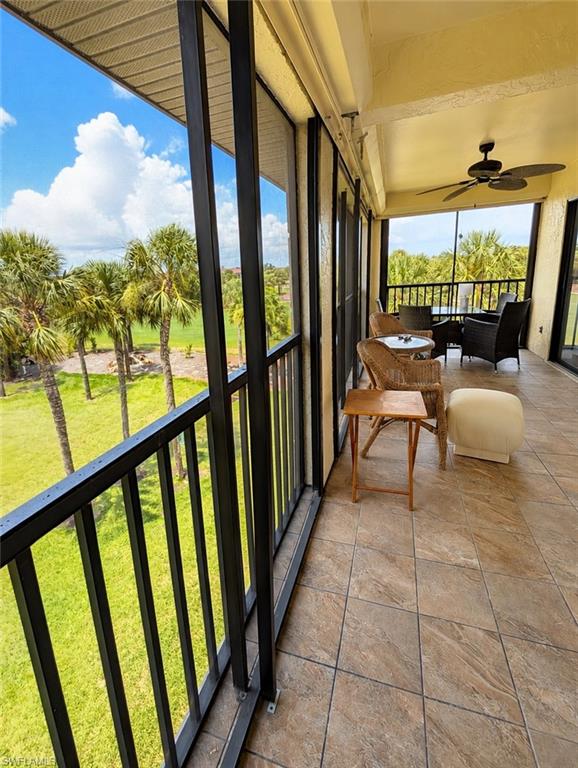 Screened-in outdoor living space with tile flooring