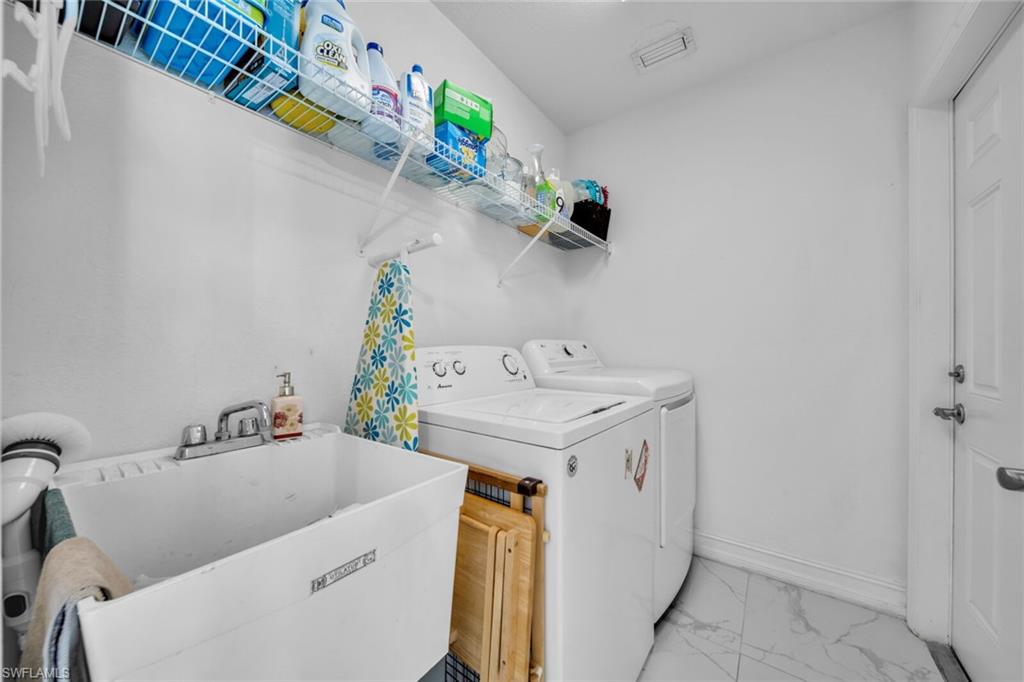 Interior laundry room with utility sink