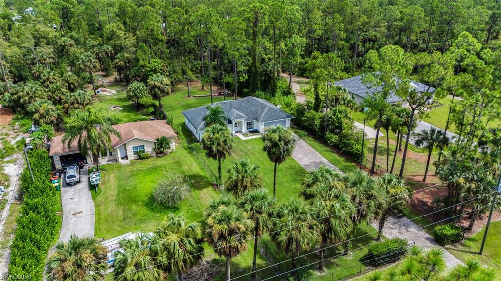 Aerial view of the property and neighborhood