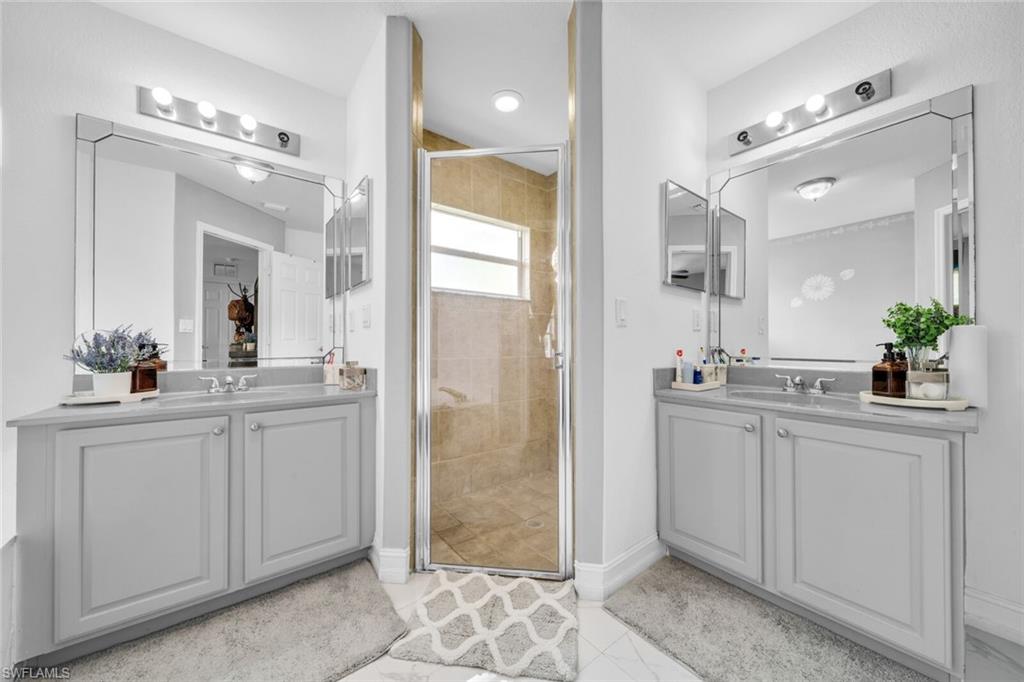 Primary bath with dual sink vanity and walk in shower