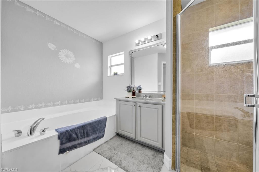 Soaking tub and separate tiled shower