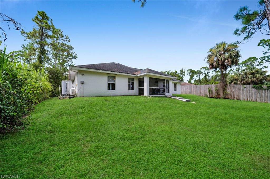 Rear exterior and open lawn