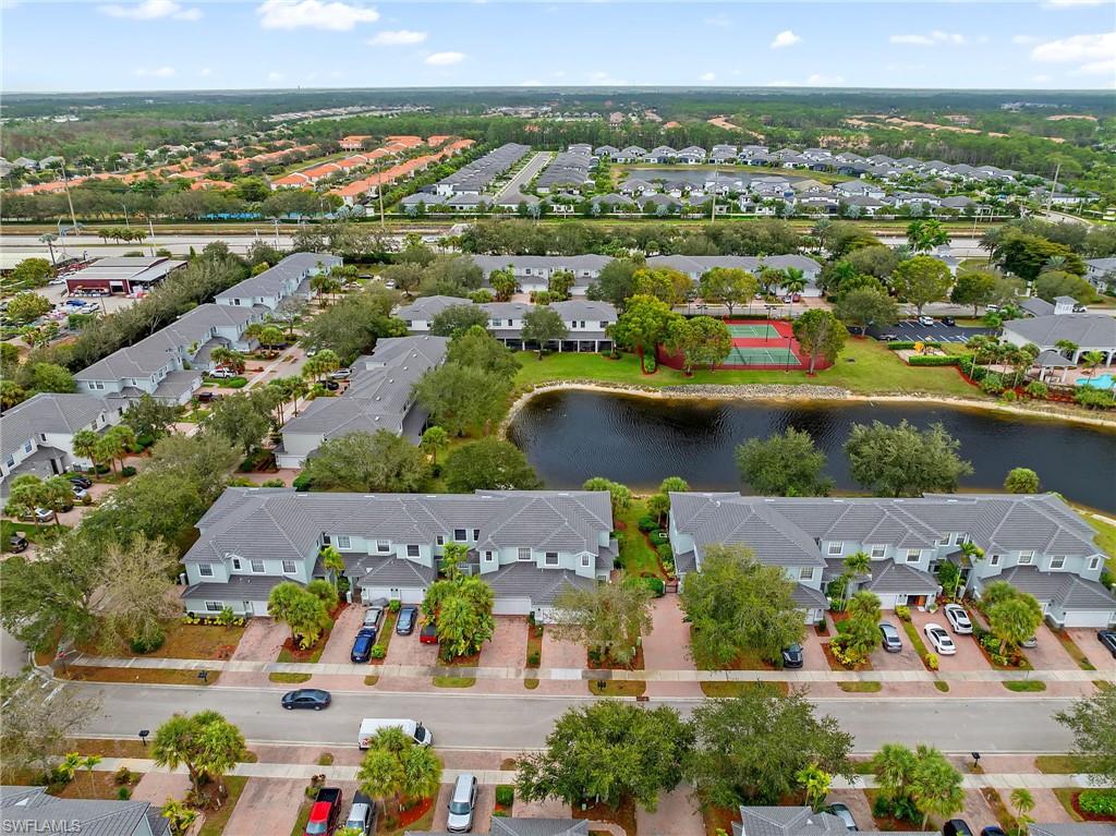 Aerial view of property's location featuring nearby suburban area and a nearby body of water