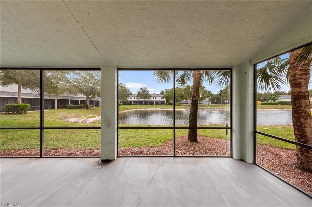 Unfurnished sunroom with a water view and healthy amount of natural light