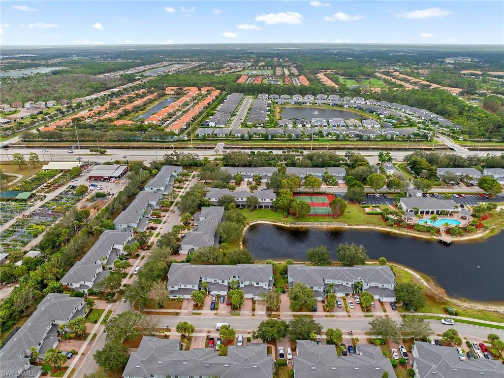View of property location featuring nearby suburban area and a nearby body of water