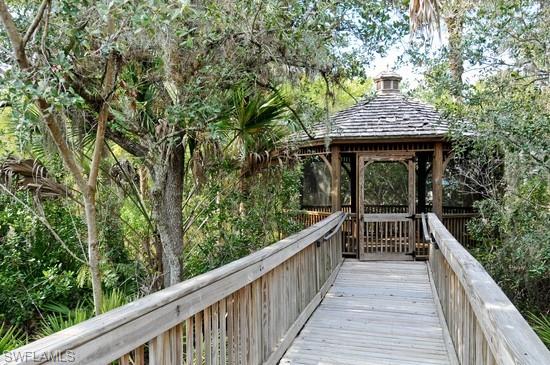 Walk on the wild side to the screened in gazebo on the river