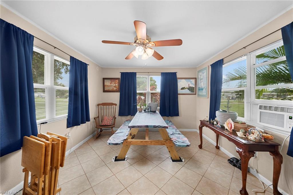 Bright interior space featuring multiple windows with blinds, offering natural light