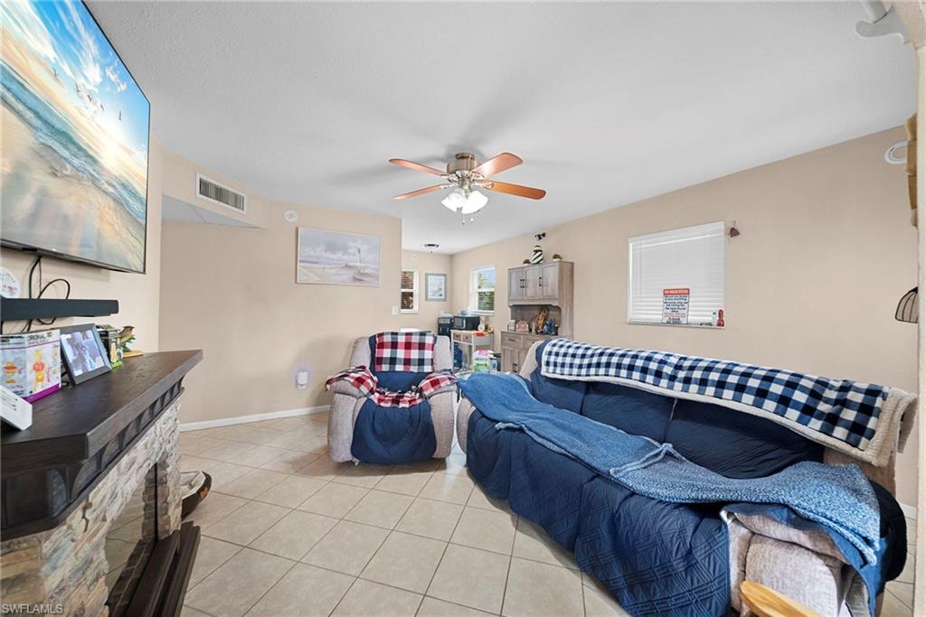 Open living area featuring tile flooring throughout