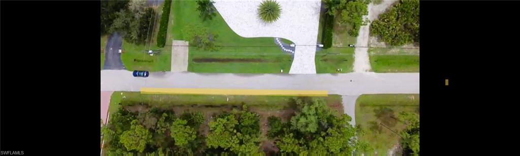 24310 GOLDEN EAGLE LANE, 1.25 ACRES, LOOKING DOWN AT PROPERTY AND FRONTAGE OF PROPERTY IS ROUGHLY HIGHLIGHTED AND ADJACENT HOUSE DRIVEWAY ON GOLDEN EAGLE LANE