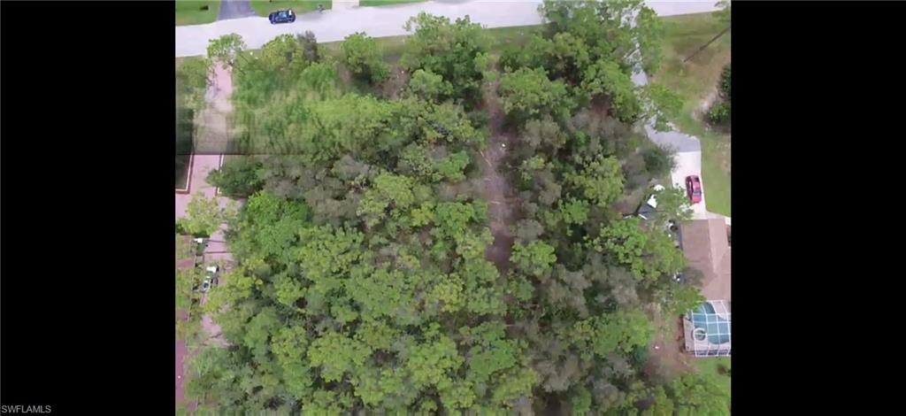 24310 GOLDEN EAGLE LANE, 1.25 ACRES, LOOKING DOWN AT PROPERTY AND ADJACENT HOUSE AND TOWARDS GOLDEN EAGLE LANE