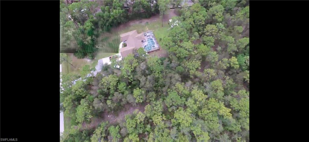 24310 GOLDEN EAGLE LANE, 1.25 ACRES, LOOKING DOWN AT FAR SIDE OF PROPERTY AND ADJACENT HOUSE