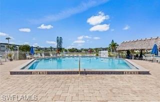 Community swimming pool with a surrounding paved deck