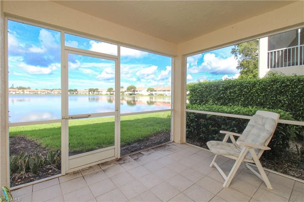 Unfurnished sunroom featuring a water view