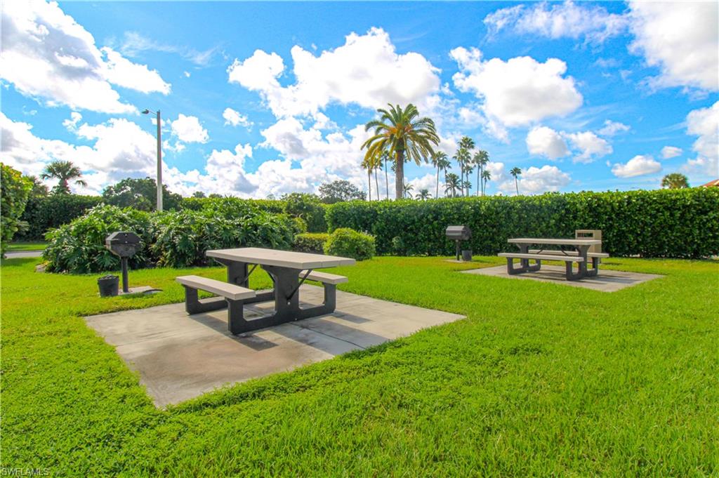 View of community with a lawn and a patio area