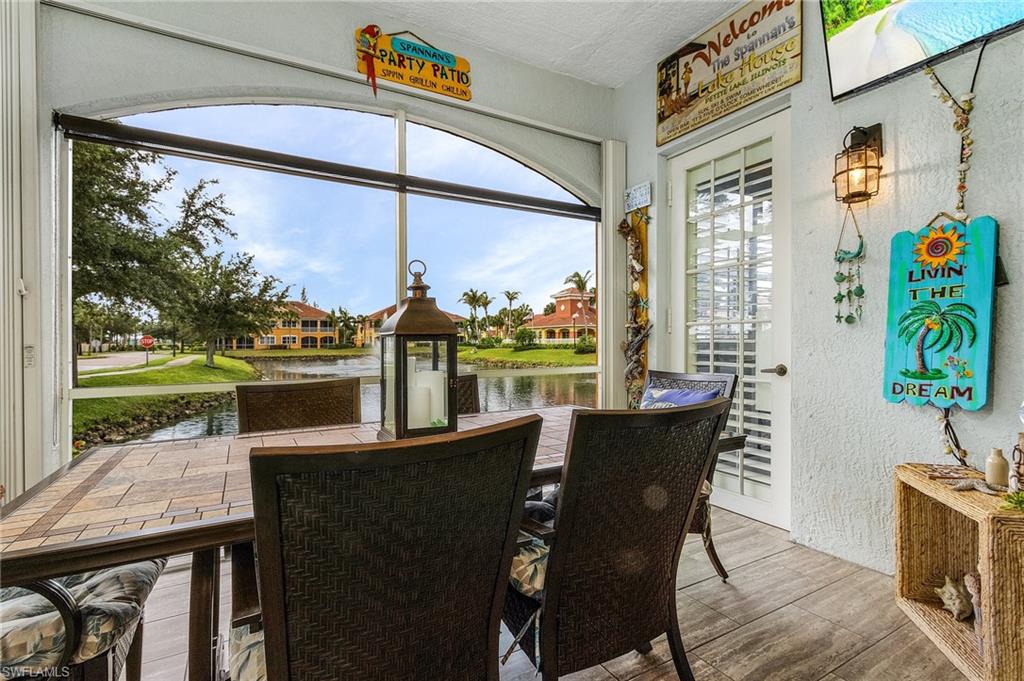 Large lanai overlooks lake and lush landscaping