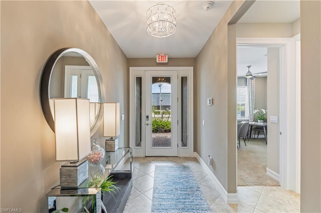Entryway featuring ceramic tile flooring and a glass-paneled front door