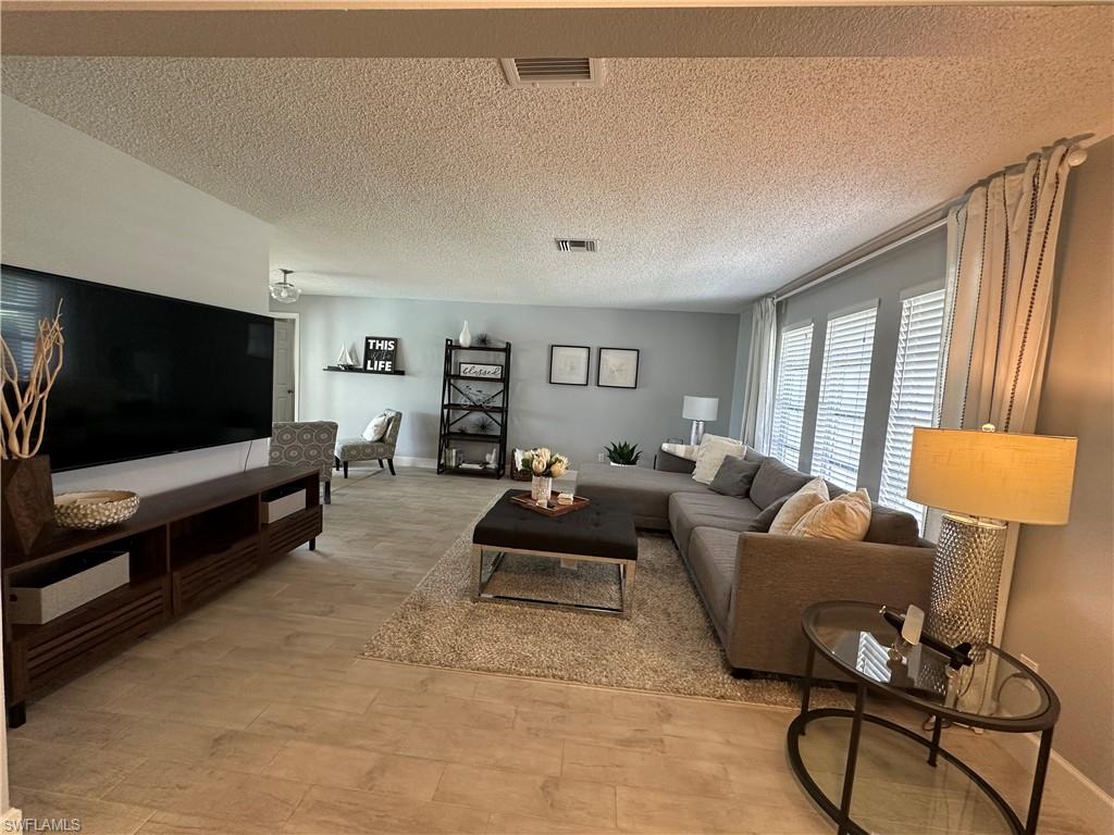 Living room with a textured ceiling