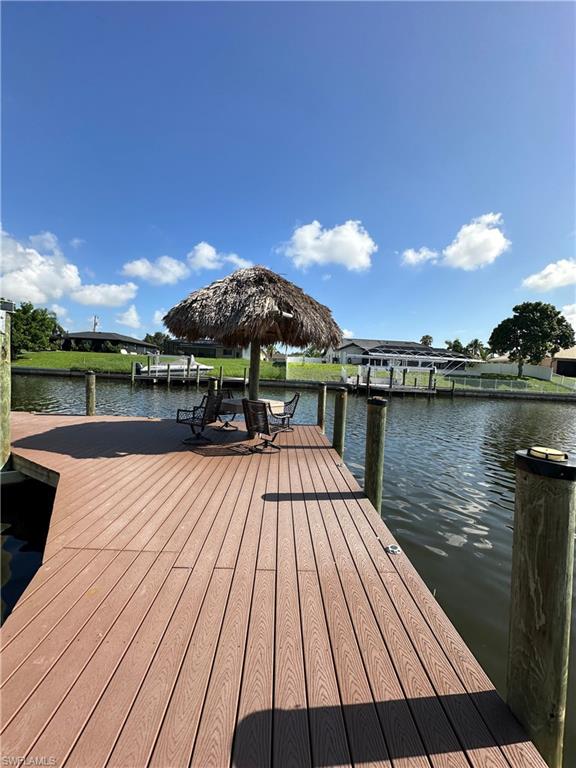 Dock area featuring a water view
