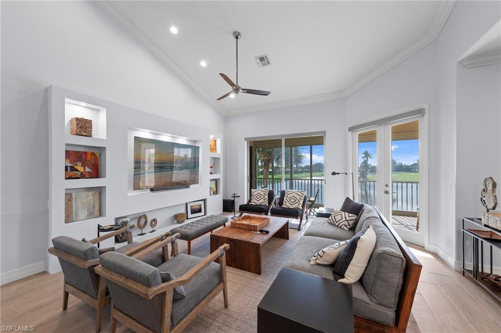 Vaulted ceiling with recessed lighting and ceiling fan