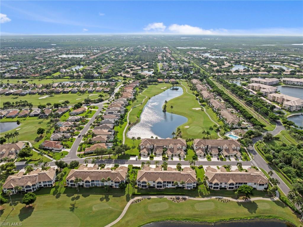 Aerial perspective showcasing a residential community with golf course frontage