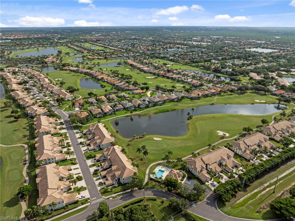 Aerial view of this gated residential community featuring expansive manicured grounds with multiple lakes, mature landscaping, and tree-lined streets throughout the development