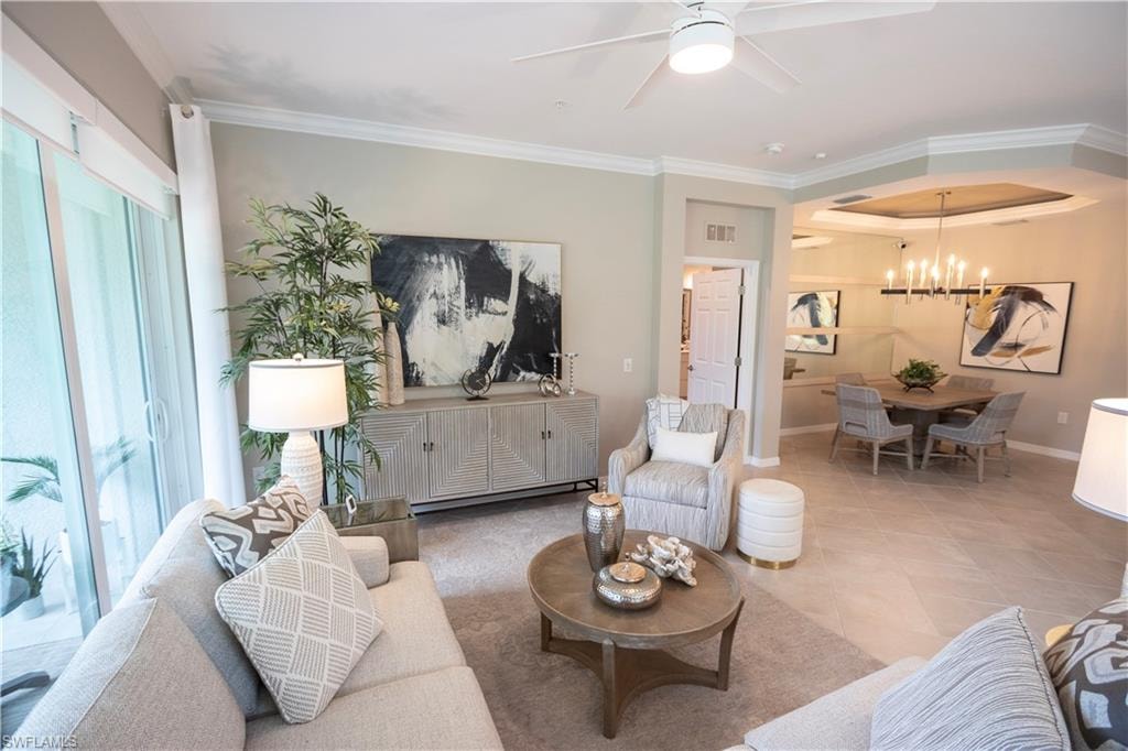 Living area featuring crown molding, a ceiling fan, and recessed lighting