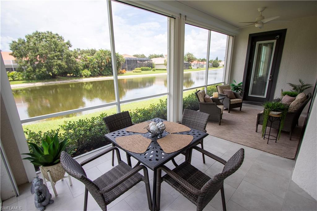 Waterfront Lanai with Expansive Glass EnclosureThis light-filled enclosed lanai showcases floor-to-ceiling glass panels framing panoramic waterfront vistas