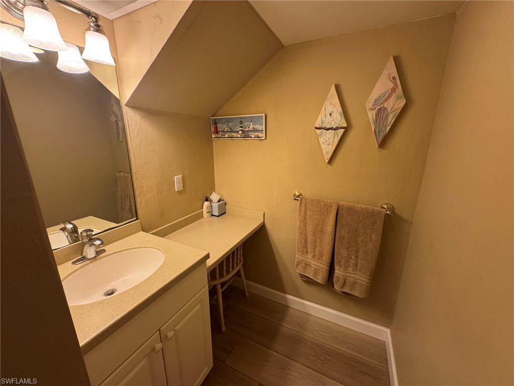 Bathroom vanity with integrated sink and chrome faucet