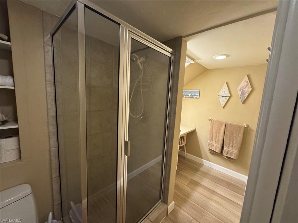 Glass shower enclosure with tiled interior