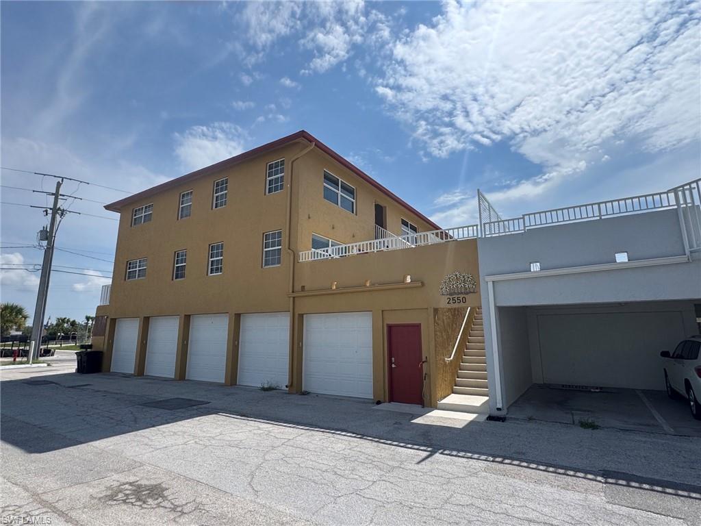 Right side of property with second stairwell for easy access from the beach.