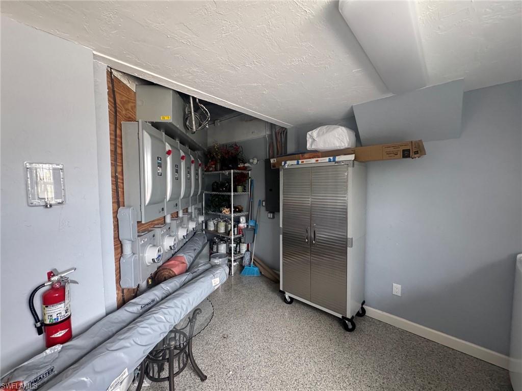 Common area storage space and electric panels.