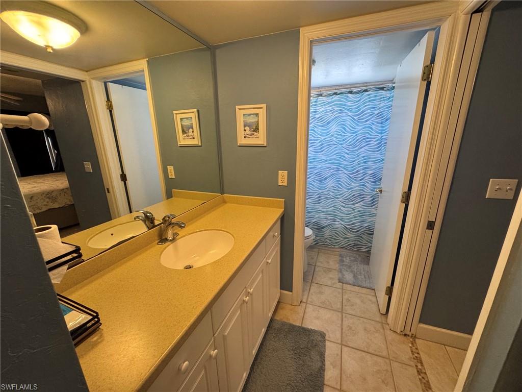 Dual vanity with integrated sinks and a speckled countertop