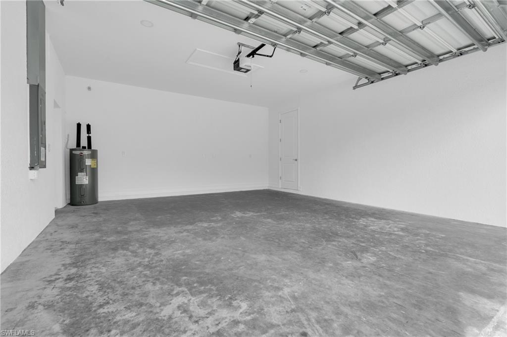 Garage with electric water heater and electric panel